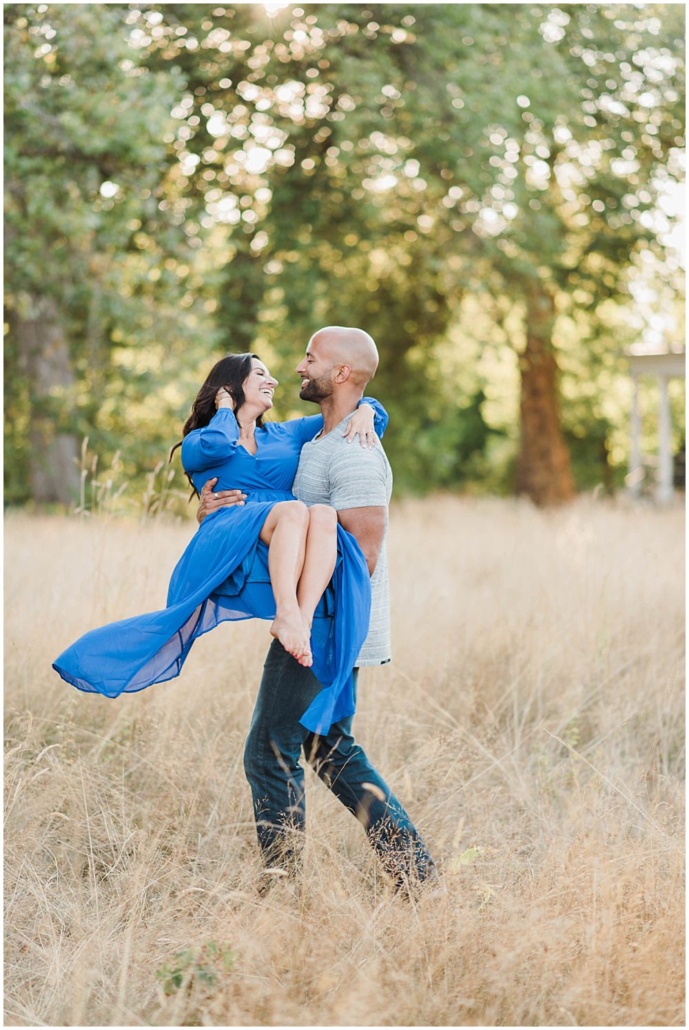  Romantic Discovery Park Seattle engagement photo in long blue lulus dress in the wild fields  | Julianna J Photography | juliannajphotography.com 